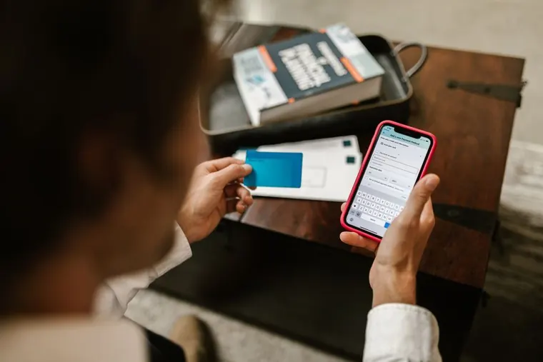 person scheduling online payment on phone