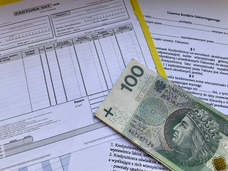stack of contractor invoices on desk