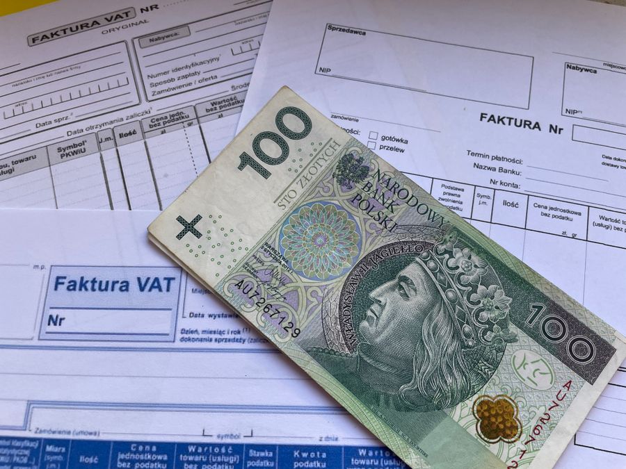 Invoice and banknote on paperwork
